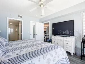 2055 S Atlantic Ave Unit 505, Daytona Beach, FL 32118 - bedroom with dark wood-style flooring and a ceiling fan