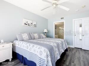 2055 S Atlantic Ave Unit 505, Daytona Beach, FL 32118 - bedroom featuring wood finished floors and ceiling fan