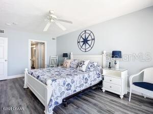 2055 S Atlantic Ave Unit 505, Daytona Beach, FL 32118 - bedroom with dark wood-style flooring and ceiling fan