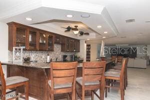 2055 S Atlantic Ave Unit 505, Daytona Beach, FL 32118 - indoor wet bar featuring recessed lighting and decorative backsplash