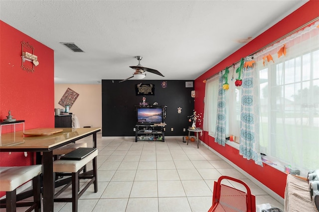 2309 Cilantro Dr, Orlando, FL 32837 - dining room featuring ceiling fan, light tile patterned floors, and an accent wall
