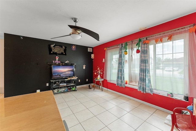 2309 Cilantro Dr, Orlando, FL 32837 - living area featuring a ceiling fan, an accent wall, and light tile patterned flooring