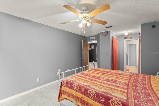 2309 Cilantro Dr, Orlando, FL 32837 - bedroom featuring light tile patterned floors, a textured ceiling, and a ceiling fan