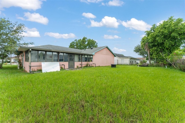 2309 Cilantro Dr, Orlando, FL 32837 - rear view of house featuring a sunroom