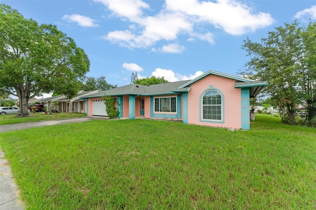 2309 Cilantro Dr, Orlando, FL 32837 - ranch-style home featuring driveway, an attached garage, stucco siding, and a front lawn