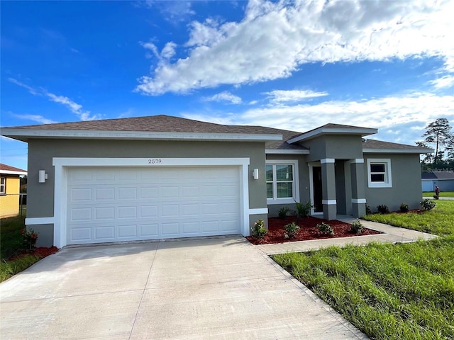 2579 SW 146th St, Ocala, FL 34473 - view of front of property with stucco siding, driveway, and an attached garage