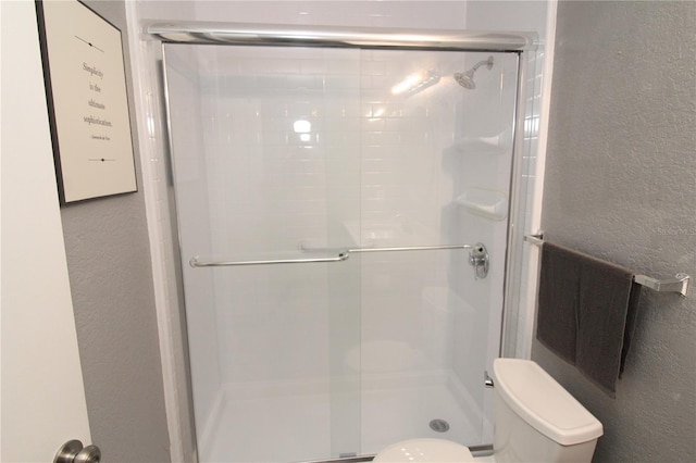 1019 S Hiawassee Rd Unit 3811, Orlando, FL 32835 - bathroom with a textured wall and a shower stall