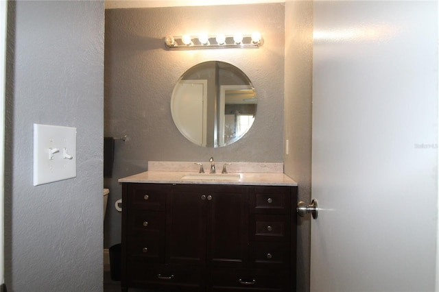 1019 S Hiawassee Rd Unit 3811, Orlando, FL 32835 - bathroom featuring vanity and a textured wall