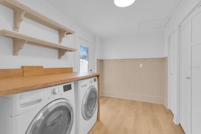 1021 S Elm Ave, Sanford, FL 32771 - laundry room featuring washing machine and dryer, light wood-style flooring, wainscoting, and attic access