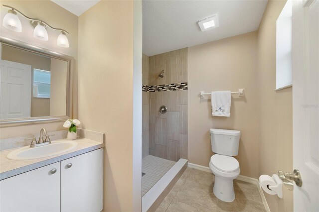 3313 Buckland St, Deltona, FL 32738 - full bath featuring vanity, a tile shower, and tile patterned floors