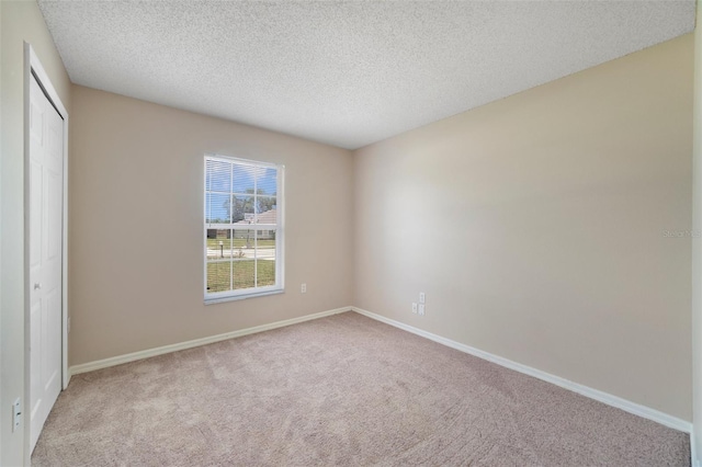 3313 Buckland St, Deltona, FL 32738 - unfurnished bedroom featuring carpet flooring, a closet, and a textured ceiling