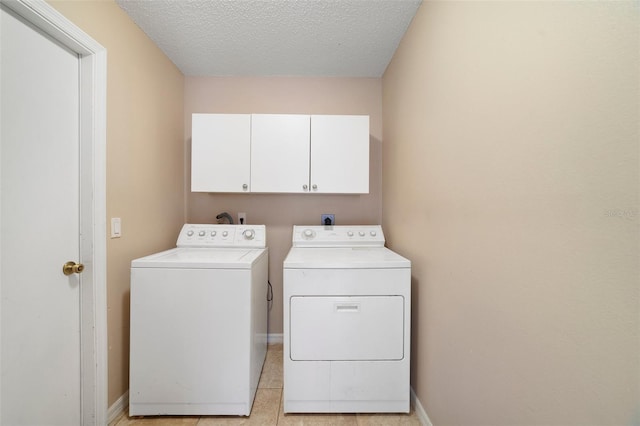 3313 Buckland St, Deltona, FL 32738 - washroom with washing machine and dryer, cabinet space, and a textured ceiling