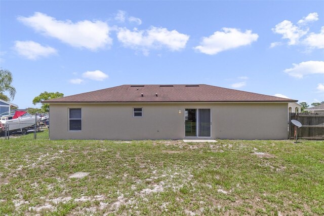 3313 Buckland St, Deltona, FL 32738 - rear view of property with stucco siding
