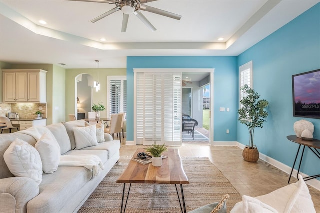 3531 Oriskany Dr, Orlando, FL 32820 - living area featuring a raised ceiling, a ceiling fan, recessed lighting, and light tile patterned floors