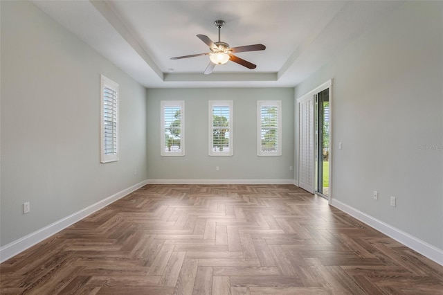 3531 Oriskany Dr, Orlando, FL 32820 - empty room featuring a tray ceiling and a ceiling fan