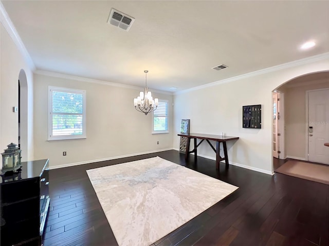 14654 Yellow Butterfly Rd, Windermere, FL 34786 - dining area featuring arched walkways, dark wood-type flooring, ornamental molding, and a chandelier
