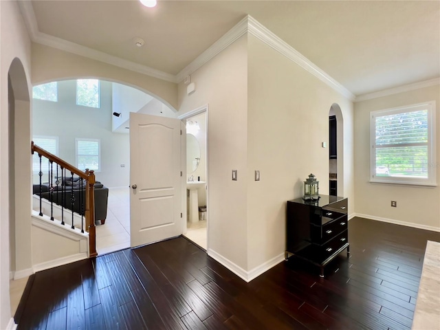 14654 Yellow Butterfly Rd, Windermere, FL 34786 - foyer entrance with arched walkways, hardwood / wood-style floors, ornamental molding, and stairs