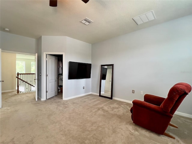 14654 Yellow Butterfly Rd, Windermere, FL 34786 - living area featuring ceiling fan, light colored carpet, and an upstairs landing