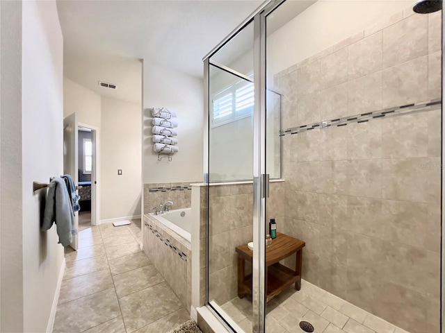 14654 Yellow Butterfly Rd, Windermere, FL 34786 - ensuite bathroom with a tile shower, plenty of natural light, tile patterned flooring, and a bath