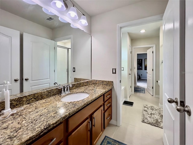 14654 Yellow Butterfly Rd, Windermere, FL 34786 - bathroom with vanity, a shower with shower door, and tile patterned flooring