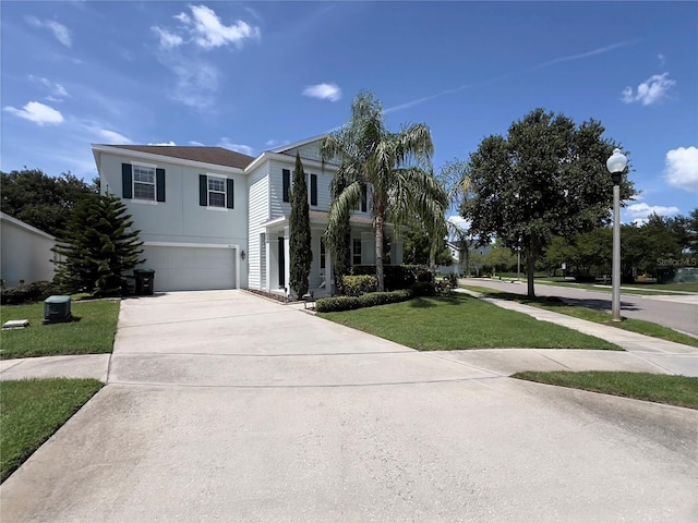 14654 Yellow Butterfly Rd, Windermere, FL 34786 - view of front of house with a garage, concrete driveway, and a front lawn