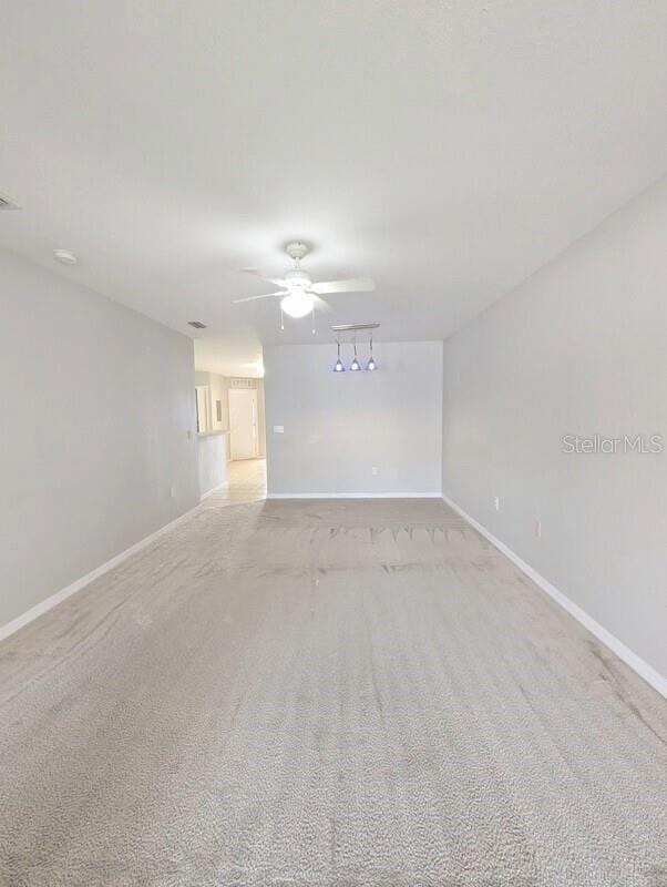 2816 Club Cortile Cir Unit A, Kissimmee, FL 34746 - unfurnished room with ceiling fan and light colored carpet