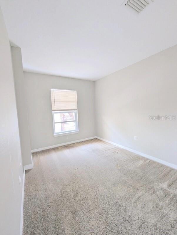 2816 Club Cortile Cir Unit A, Kissimmee, FL 34746 - carpeted empty room featuring baseboards