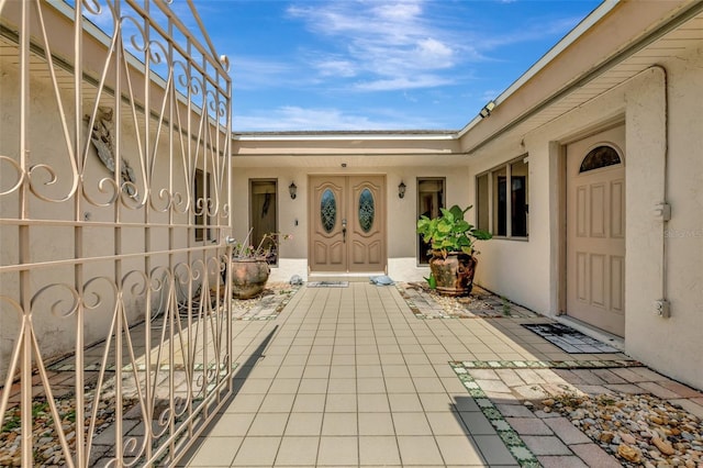 1701 Bayshore Dr, Hutchinson Island, FL 34949 - view of exterior entry featuring stucco siding