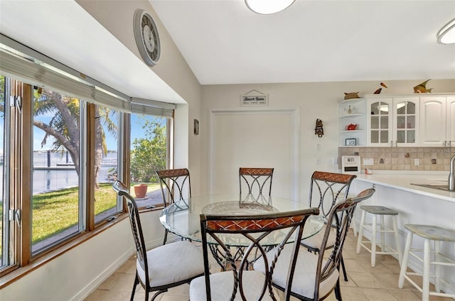 1701 Bayshore Dr, Hutchinson Island, FL 34949 - dining space featuring light tile patterned floors and a water view