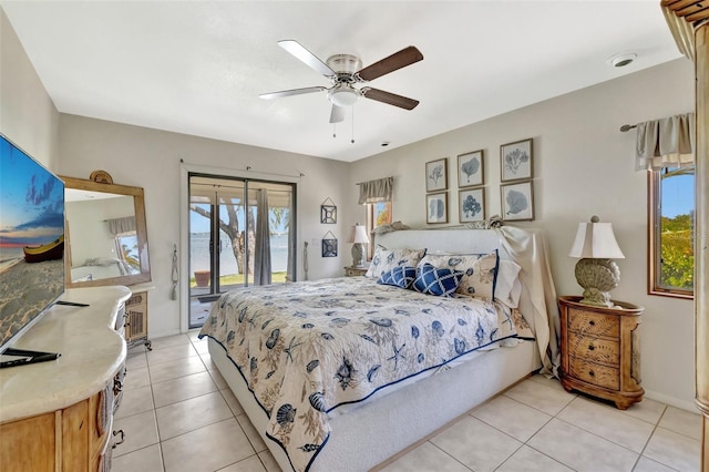 1701 Bayshore Dr, Hutchinson Island, FL 34949 - bedroom featuring access to exterior, light tile patterned floors, and a ceiling fan