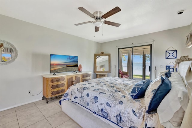 1701 Bayshore Dr, Hutchinson Island, FL 34949 - bedroom with access to exterior, light tile patterned flooring, and ceiling fan