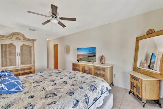 1701 Bayshore Dr, Hutchinson Island, FL 34949 - bedroom featuring light tile patterned floors and a ceiling fan
