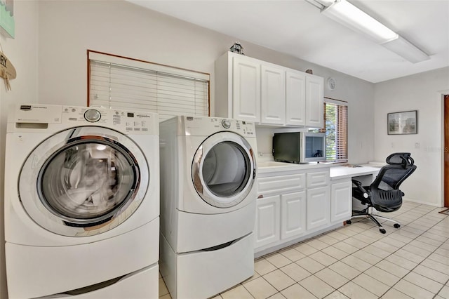 1701 Bayshore Dr, Hutchinson Island, FL 34949 - washroom featuring washer and clothes dryer, cabinet space, an office area, and light tile patterned floors