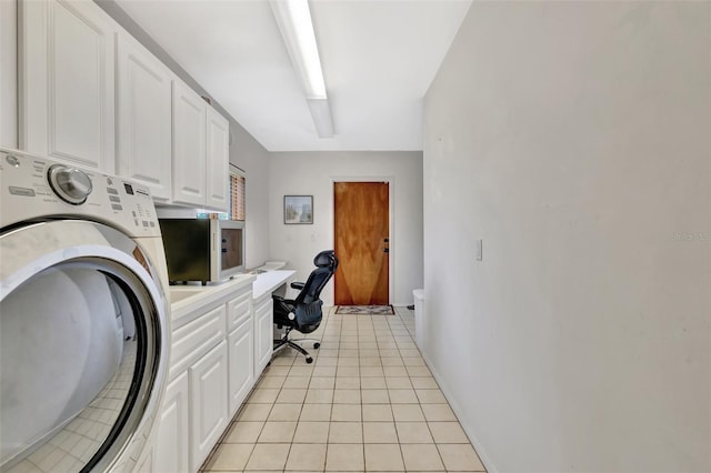 1701 Bayshore Dr, Hutchinson Island, FL 34949 - laundry room with washer / clothes dryer, cabinet space, an office area, and light tile patterned floors