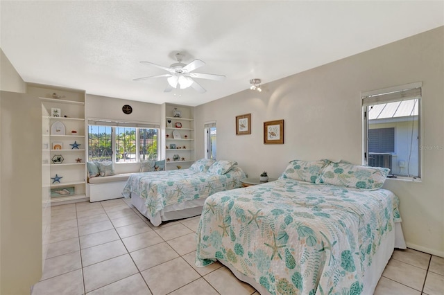 1701 Bayshore Dr, Hutchinson Island, FL 34949 - bedroom featuring light tile patterned floors, multiple windows, a ceiling fan, and cooling unit