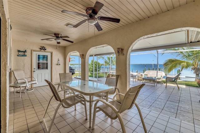 1701 Bayshore Dr, Hutchinson Island, FL 34949 - view of patio / terrace with a water view, ceiling fan, and outdoor dining area