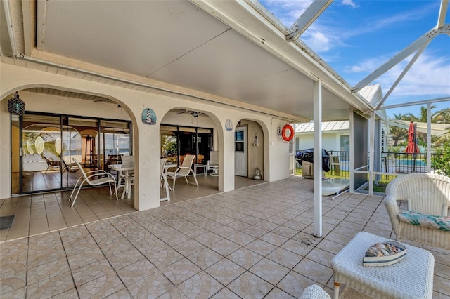 1701 Bayshore Dr, Hutchinson Island, FL 34949 - view of patio featuring area for grilling, a lanai, outdoor dining space, and ceiling fan
