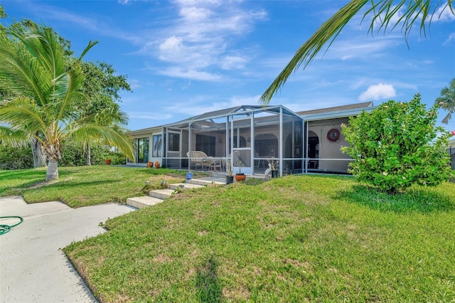 1701 Bayshore Dr, Hutchinson Island, FL 34949 - view of green lawn with glass enclosure