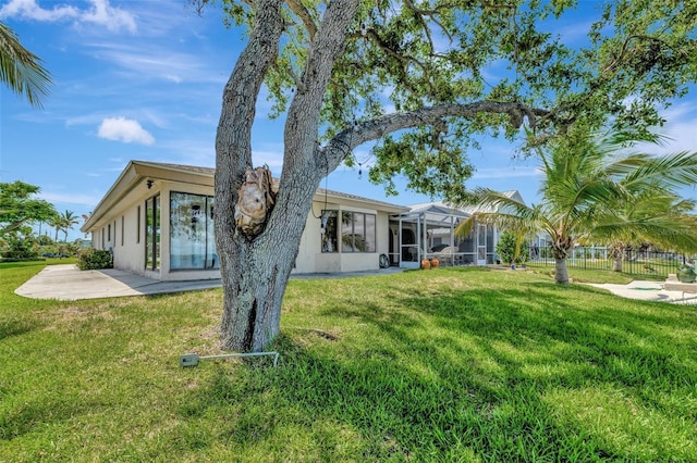 1701 Bayshore Dr, Hutchinson Island, FL 34949 - back of property featuring a patio area, a lanai, and stucco siding