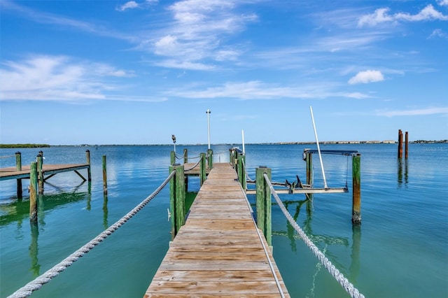 1701 Bayshore Dr, Hutchinson Island, FL 34949 - dock featuring boat lift and a water view