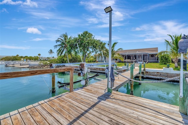 1701 Bayshore Dr, Hutchinson Island, FL 34949 - dock area featuring a water view, boat lift, and a yard