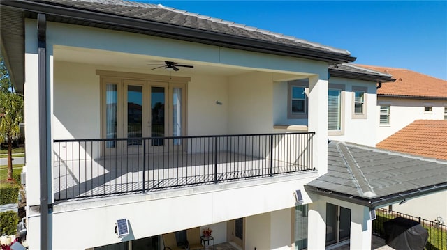10427 Royal Cypress Way, Orlando, FL 32836 - rear view of property with stucco siding, french doors, a balcony, and a ceiling fan