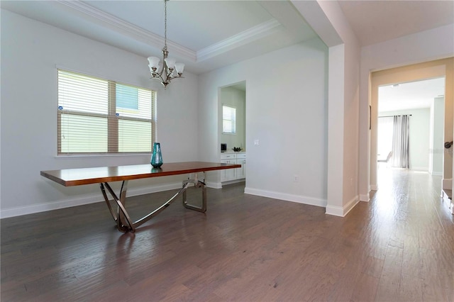 10427 Royal Cypress Way, Orlando, FL 32836 - unfurnished dining area with a chandelier, dark wood-style flooring, ornamental molding, and a tray ceiling