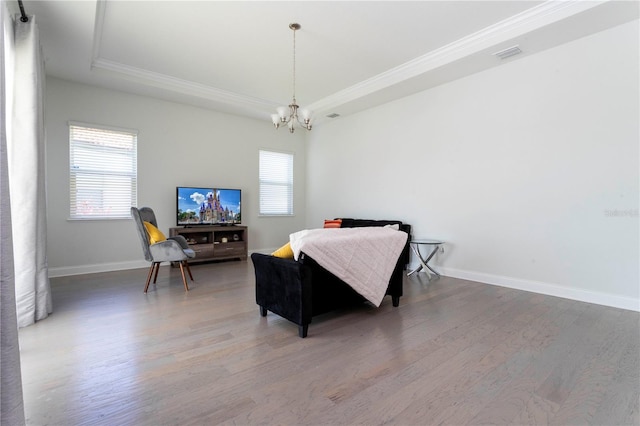 10427 Royal Cypress Way, Orlando, FL 32836 - bedroom with a raised ceiling, ornamental molding, wood finished floors, and a chandelier