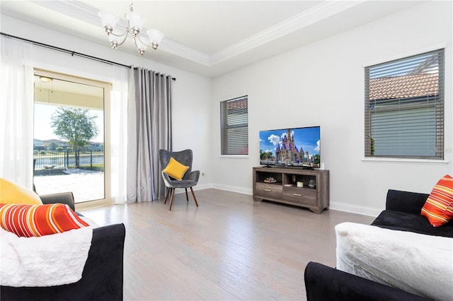 10427 Royal Cypress Way, Orlando, FL 32836 - living area featuring crown molding, a chandelier, and wood finished floors