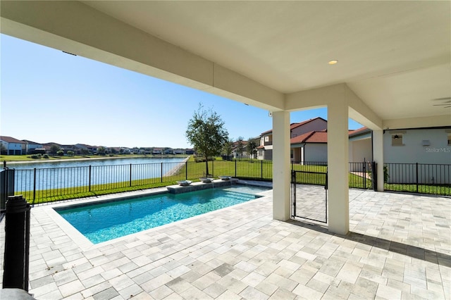 10427 Royal Cypress Way, Orlando, FL 32836 - view of swimming pool featuring a patio, a water view, a fenced backyard, and a residential view
