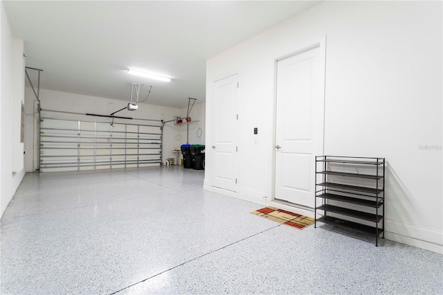 10427 Royal Cypress Way, Orlando, FL 32836 - garage featuring a garage door opener and baseboards