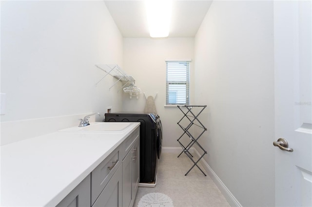 10427 Royal Cypress Way, Orlando, FL 32836 - laundry area with washer and clothes dryer and cabinet space