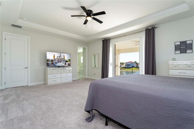 10427 Royal Cypress Way, Orlando, FL 32836 - bedroom with a raised ceiling, crown molding, access to exterior, carpet floors, and a ceiling fan