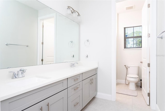 10427 Royal Cypress Way, Orlando, FL 32836 - bathroom featuring double vanity and tile patterned floors